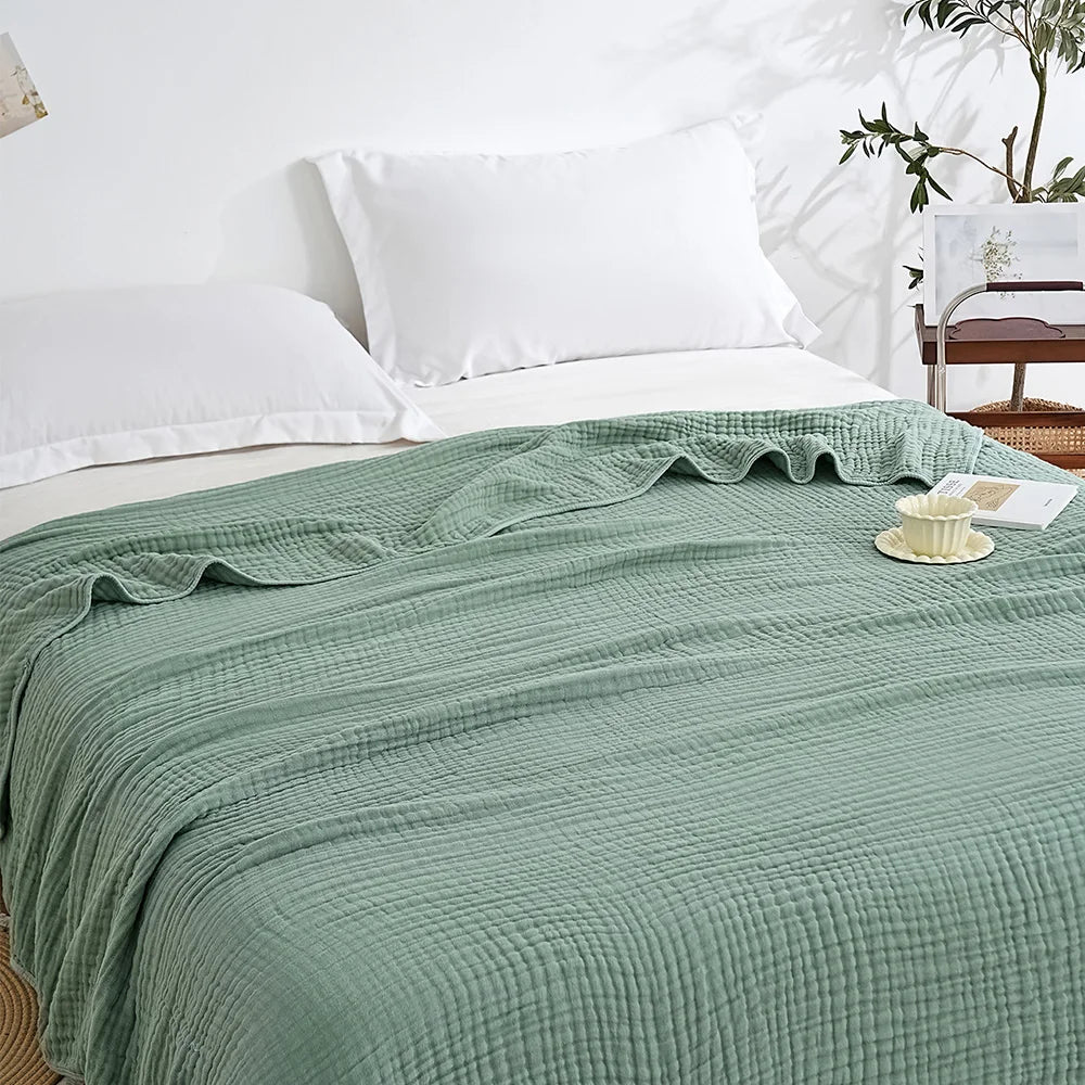 Gray-green cotton muslin throw blanket (supplier photo)