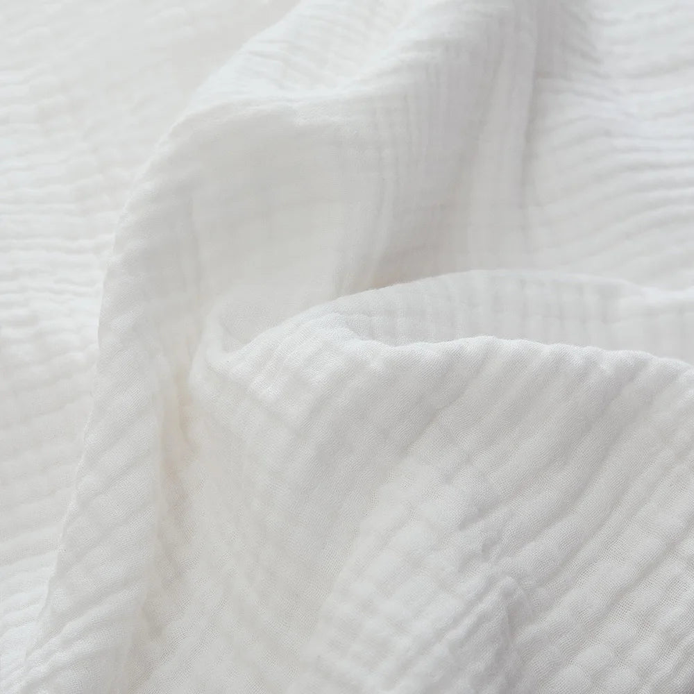 Close-up of white six-layer cotton muslin texture (supplier photo)