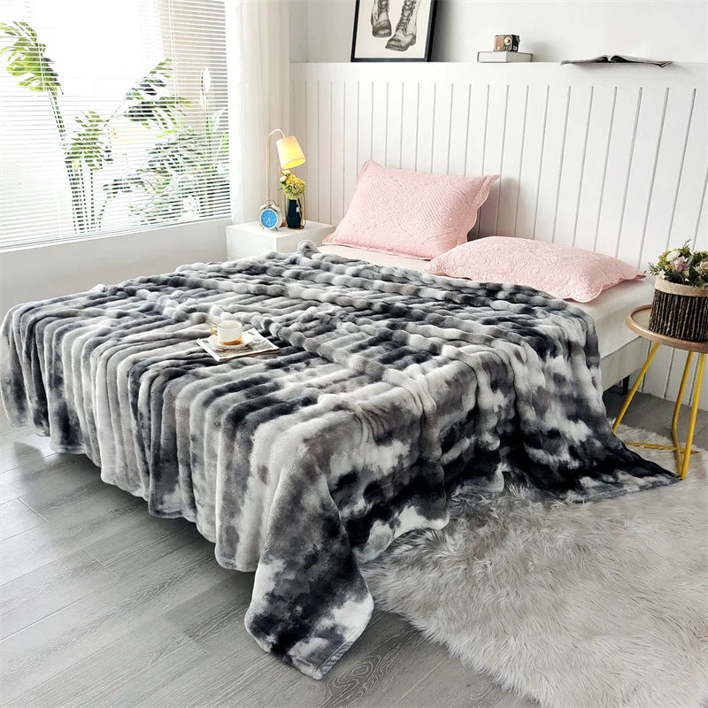 Charcoal gradient bubble faux fur throw spread across a bed (supplier photo)